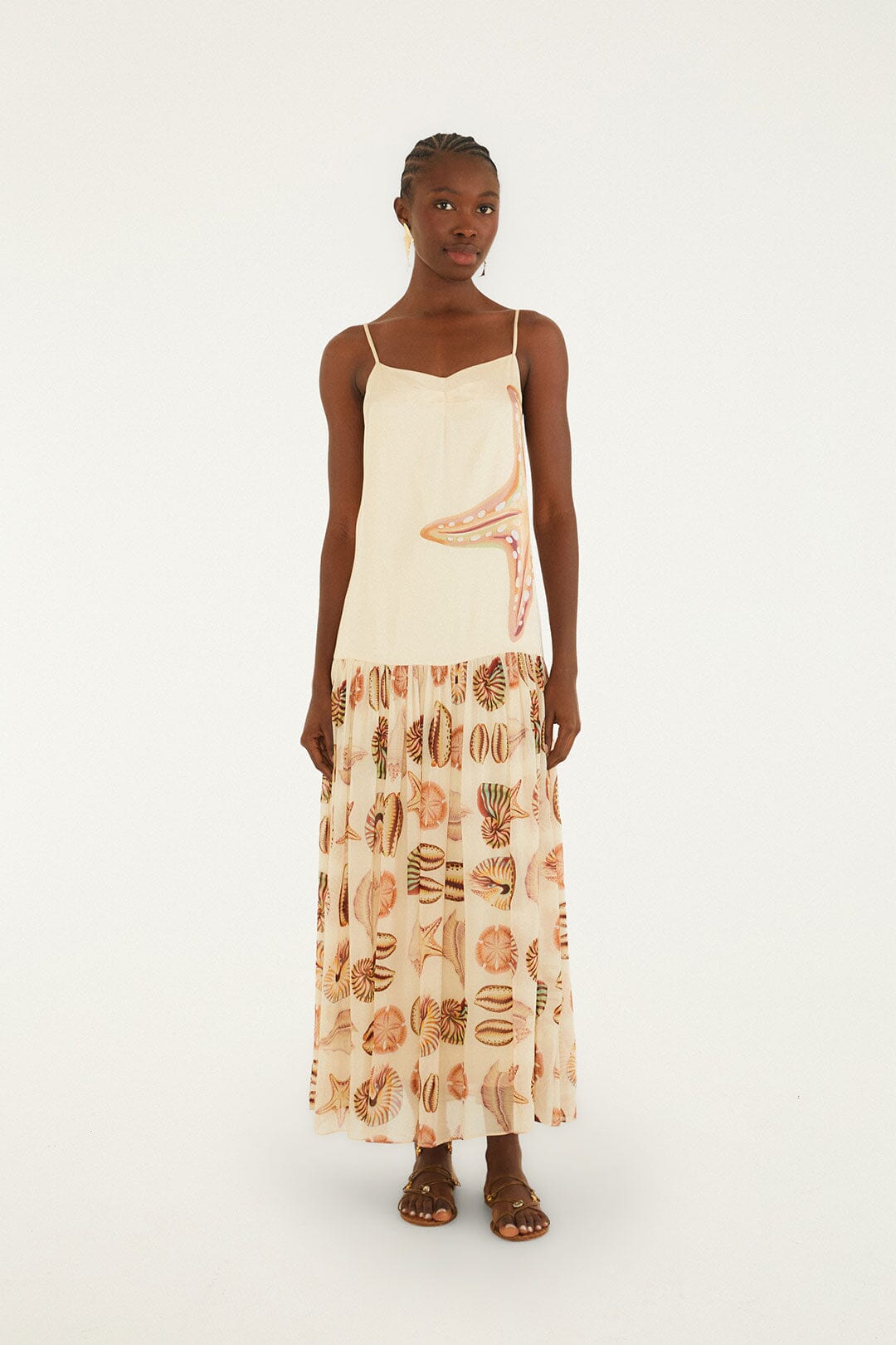 FARM Rio model wearing the Sand Marine Shells Pleated Sleeveless Maxi Dress