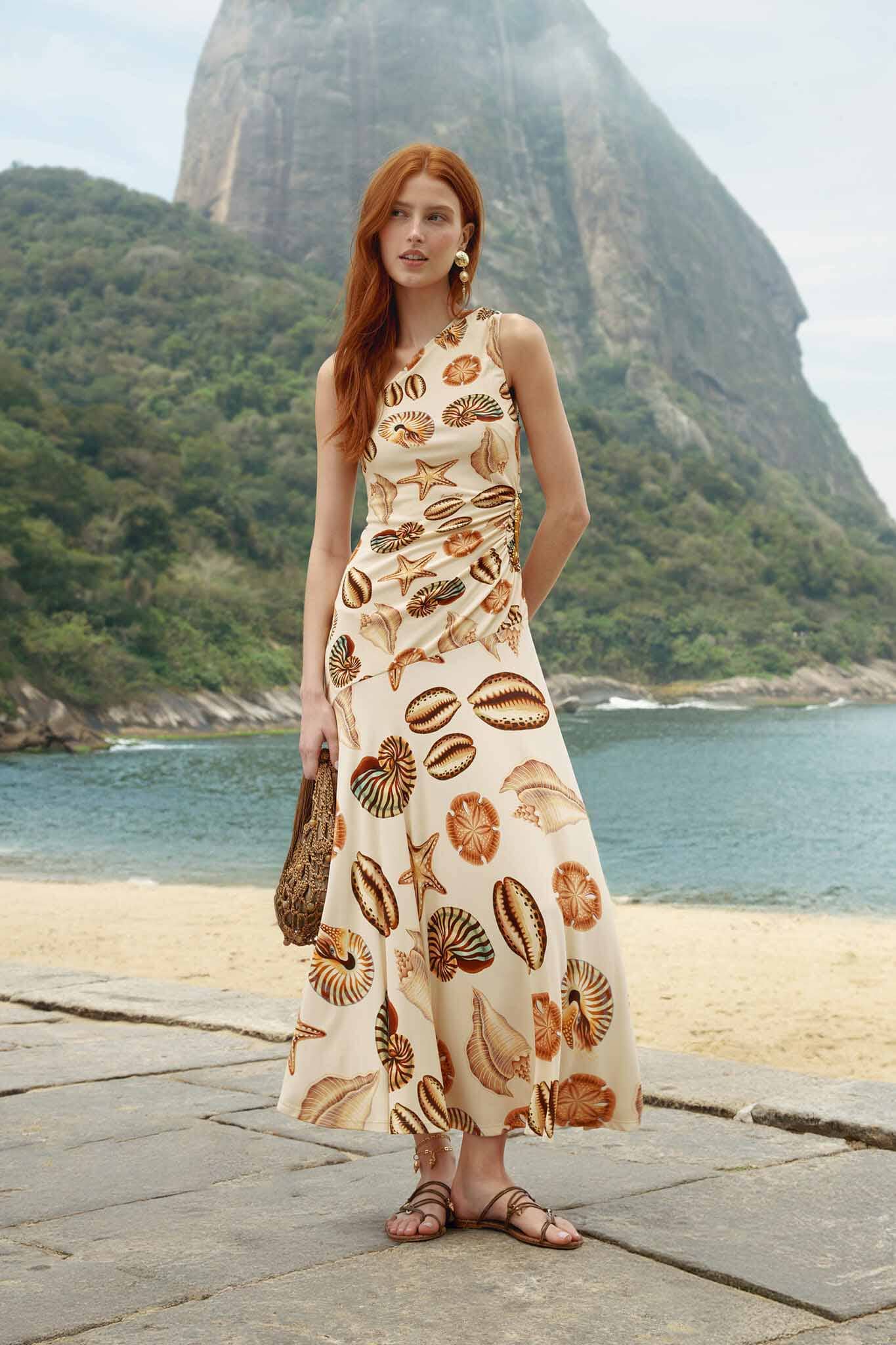 FARM Rio model wearing the Sand Marine Shells Tassel One-Shoulder Maxi Dress