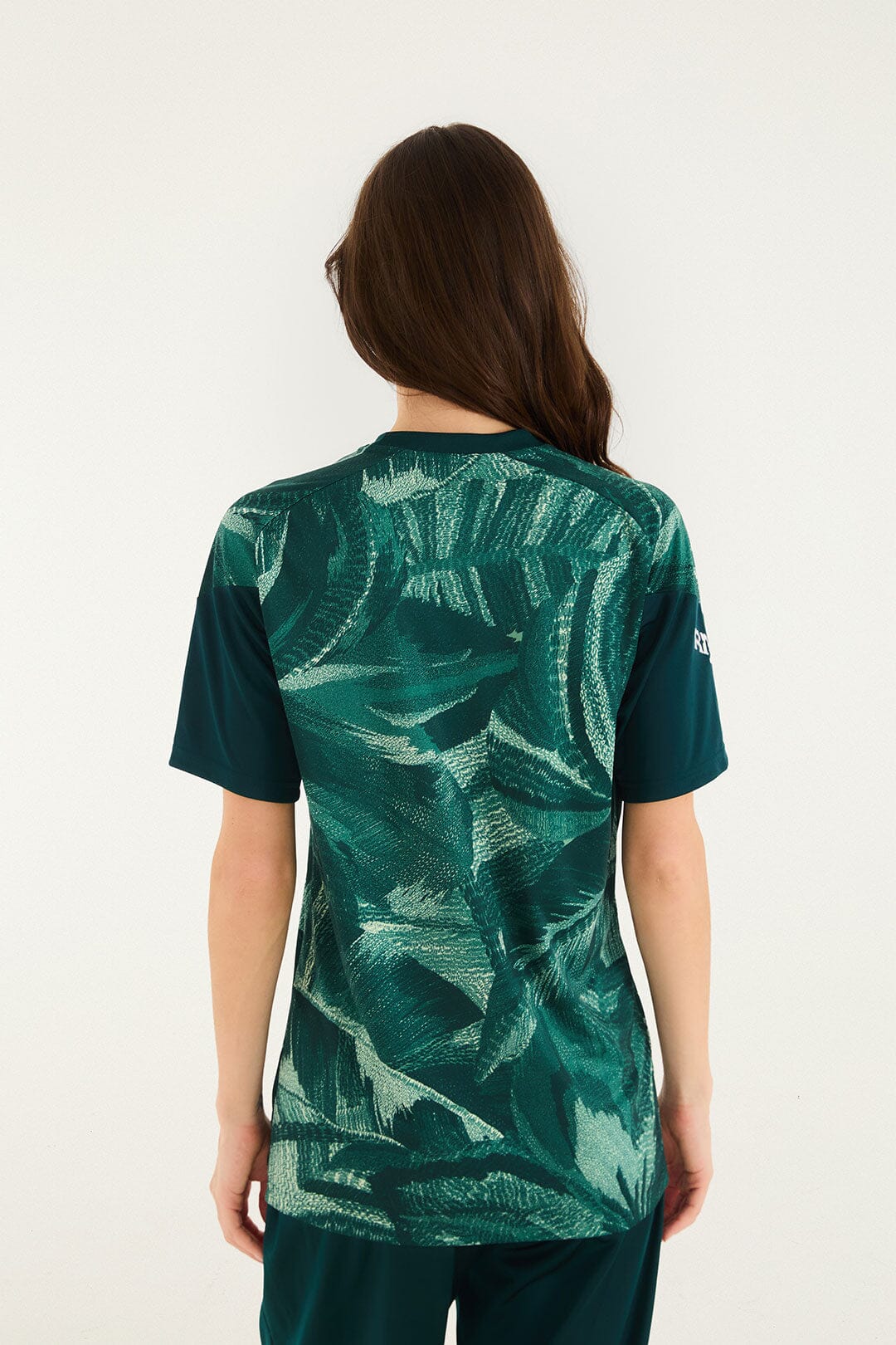 FARM Rio model wearing the Tshirt Adidas Abstract Forrest Green